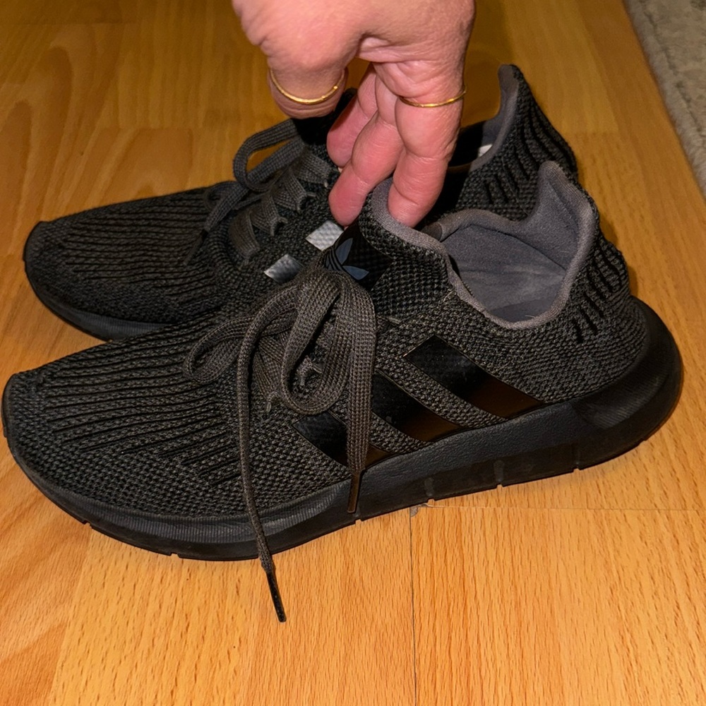 Black adidas ortholite tennis shoes.